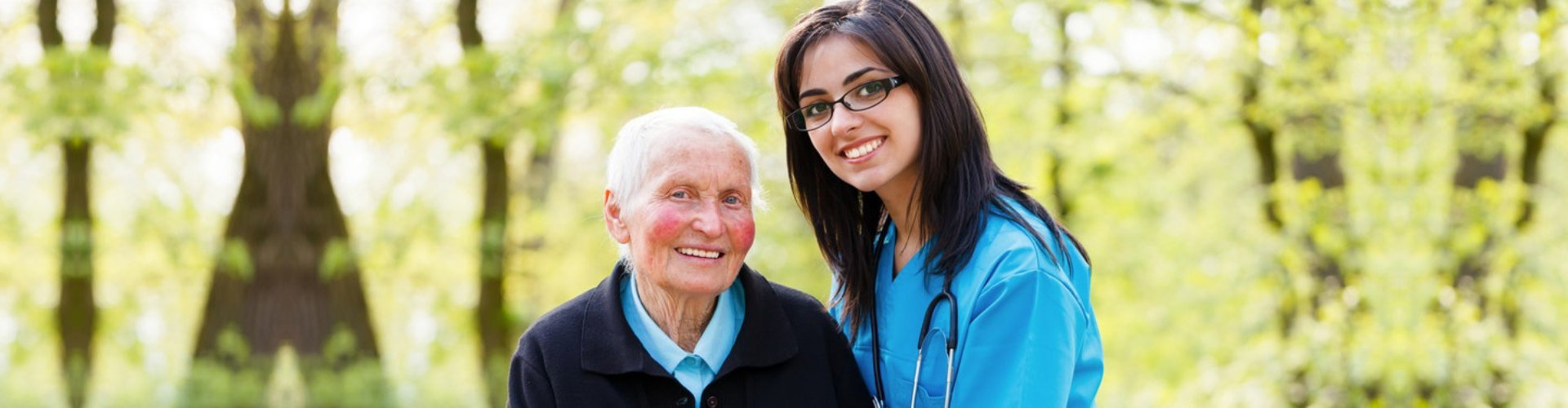 caregiver with elder woman outdoors